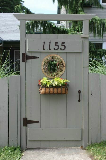 Simple grey gate with flower basket